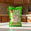 Green package of Sains Soili with a picture of white fish on a white background