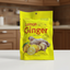 Yellow package of lemon ginger hard candies with ginger and lemon illustrations on a white background.