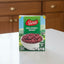 Box of Swiss Red Kidney Beans with a bowl of beans on a scenic background