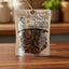 Packaged dried mushrooms with visible brand name on a green background