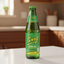 Green bottle of Ting sparkling grapefruit drink on a white background