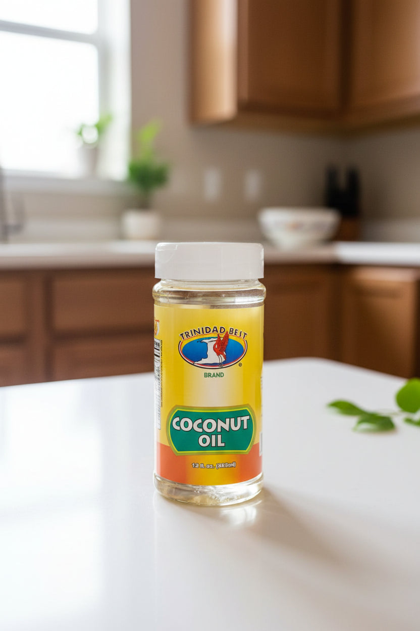 Bottle of Trinidad Bel? coconut oil on a dark surface