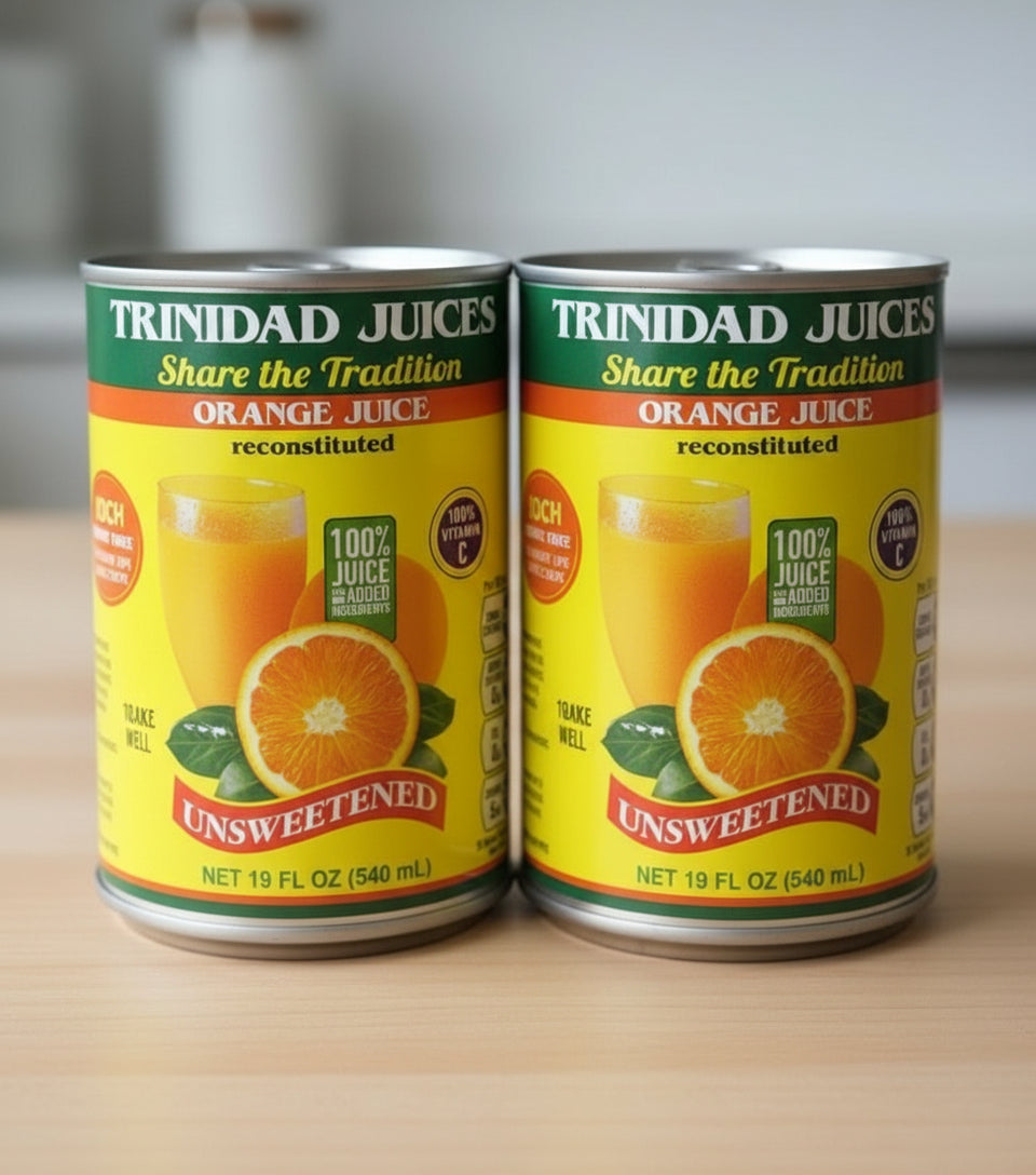 Can of Trinidad Juices orange juice on a wooden surface