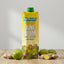 Tru Juice June Plum Fruit Nectar carton with plums and ginger on a wooden surface