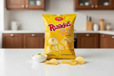 Yellow package of Yupi Rizadas Potato Chips Mayonnaise Flavored on a white background