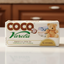 Coco Varela laundry detergent packaging with a teddy bear and baby clothes illustration on a white background.
