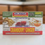 Box of Dr. Robert's Instant Cranberry Ginger Tea on a dark surface