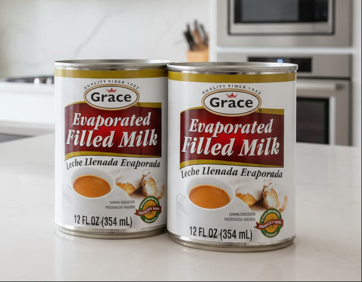 Two cans of Grace Evaporated Filled Milk on a white background