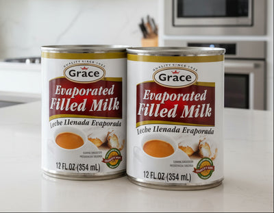 Two cans of Grace Evaporated Filled Milk on a white background