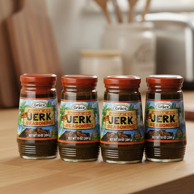 Four bottles of Grace Jamaican Jerk Seasoning on a white background
