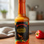 Bottle of Walkerswood Jamaican Scotch Bonnet pepper sauce on a white background