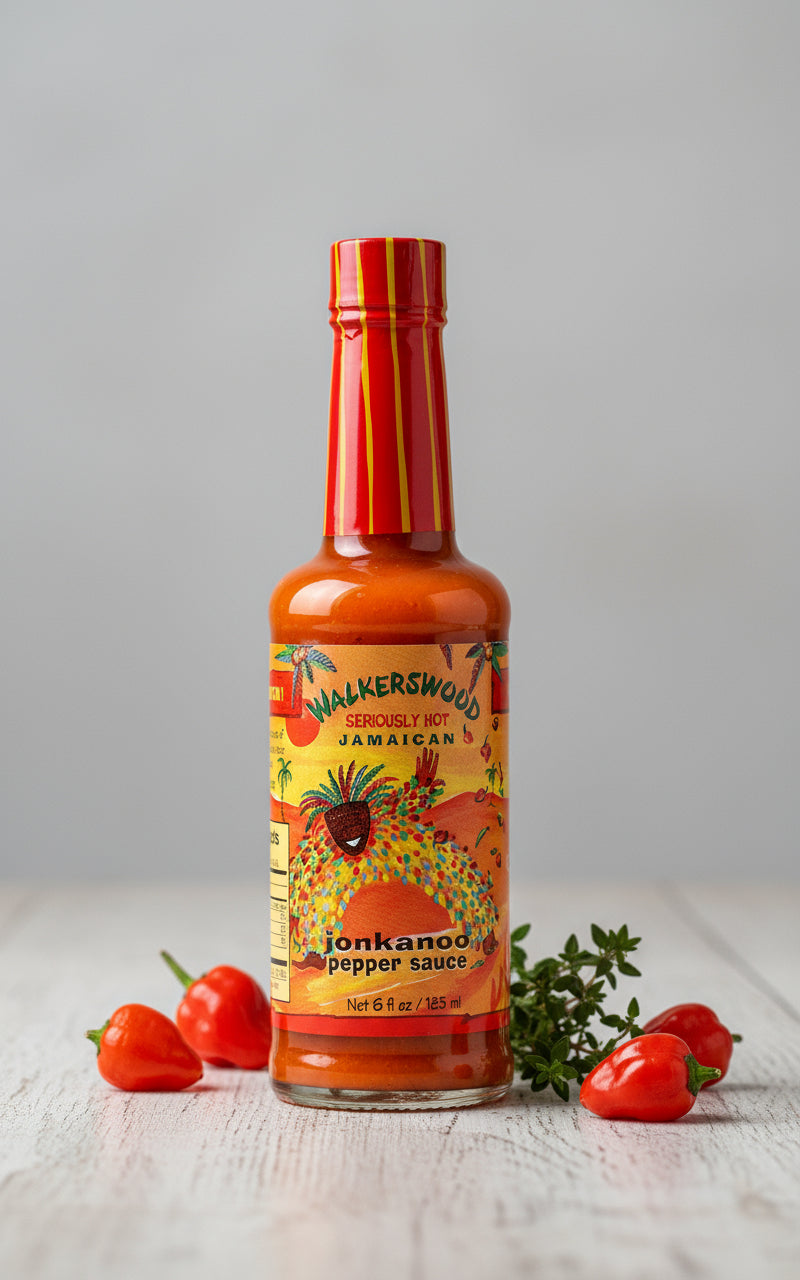 Bottle of Walkerswood Jonkanoo Pepper Sauce with colorful label on a white background
